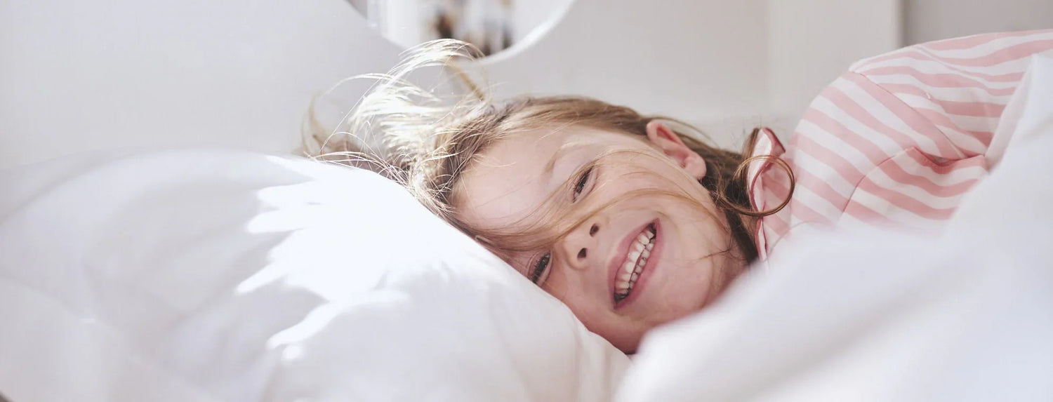 Girl smiling in bed